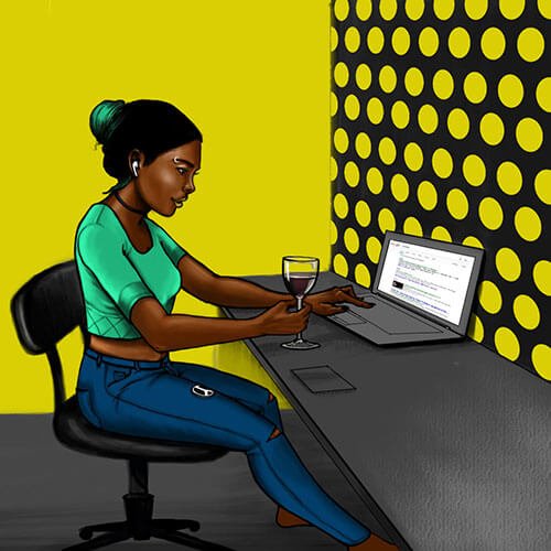 A woman working at a digital marketing agency in front of a laptop